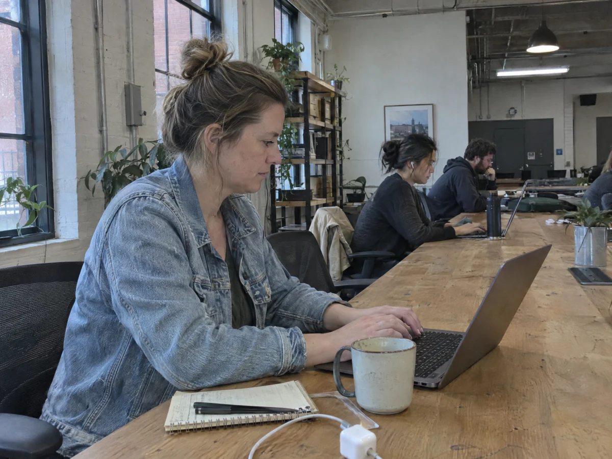 Contract digital marketer working from a sunny co-working space