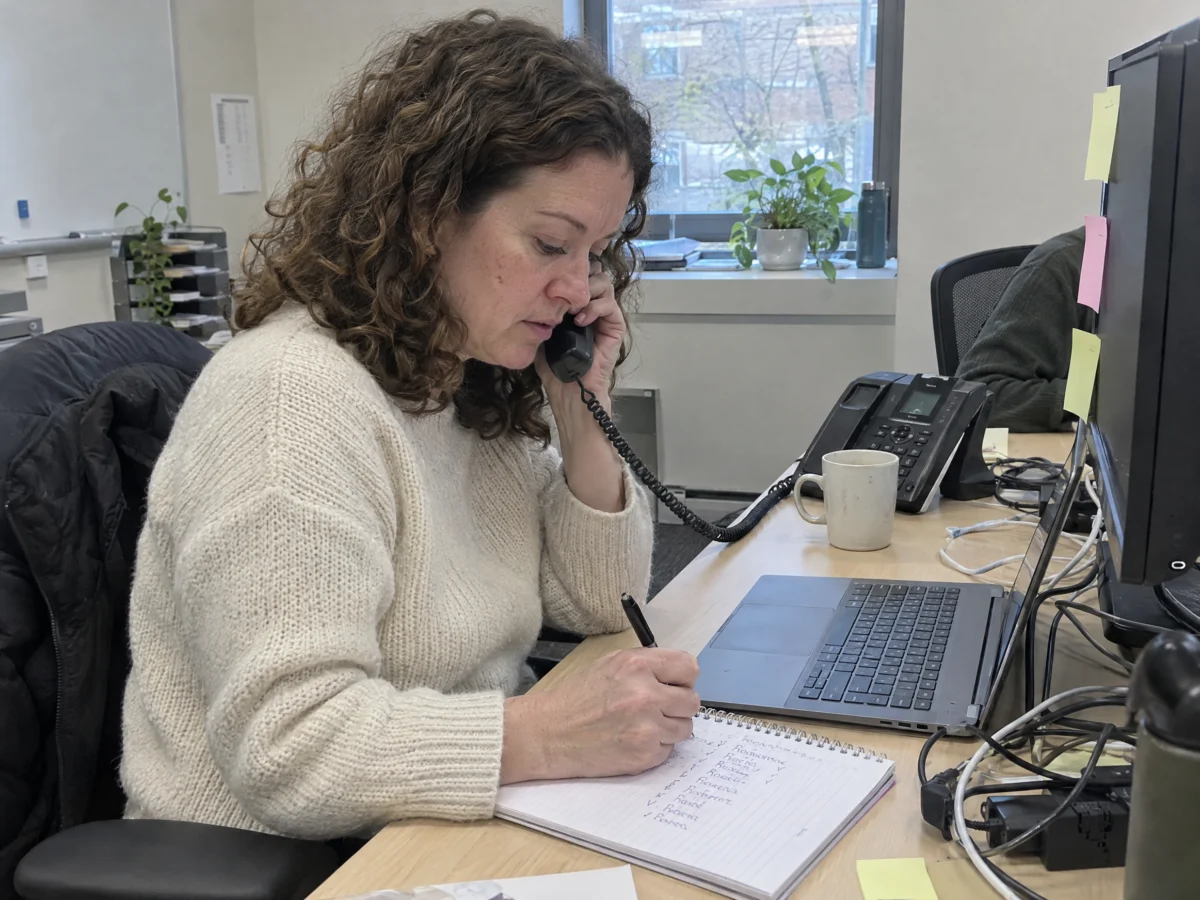 Recruiter on a call reviewing candidate notes