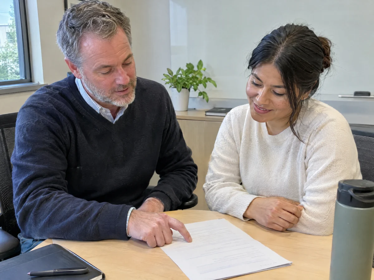 Manager and employee in a positive review meeting