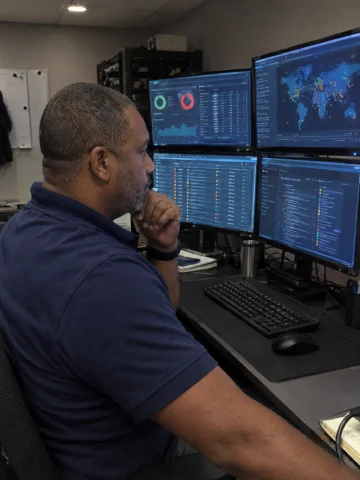 Cybersecurity analyst at work in a modern office